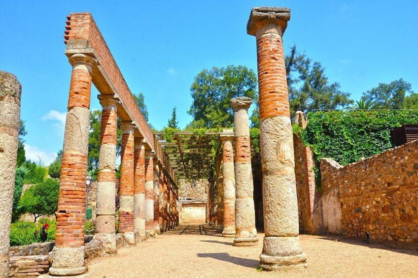Ancient brick columns in a garden setting. 5