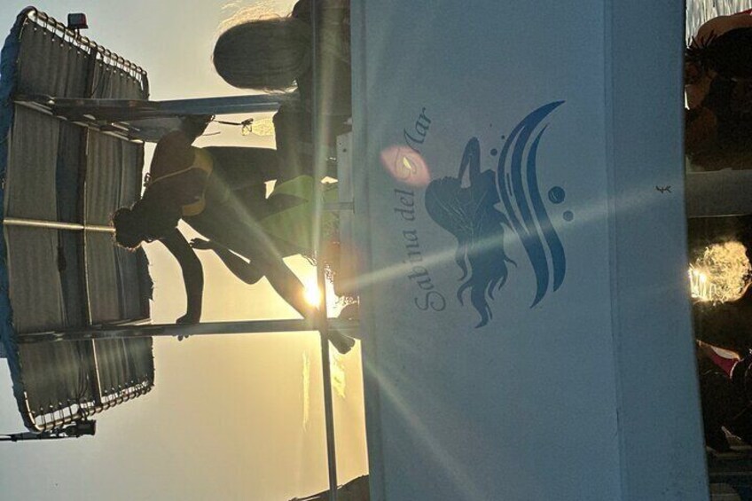 A person lifting a large object with a logo of a bird and the text "Sunrise". 5
