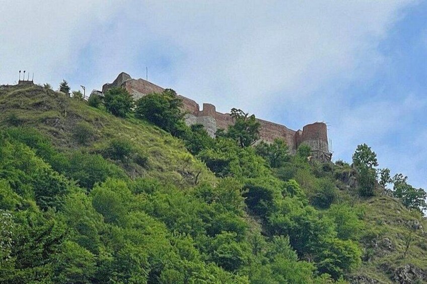 A hill with a historical fortification on top. 3
