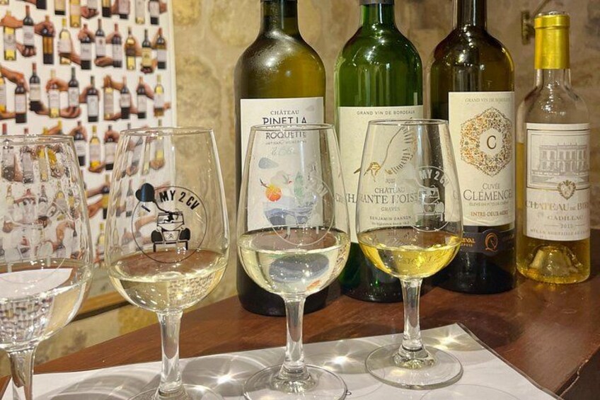 Wine bottles and glasses on a table. 3