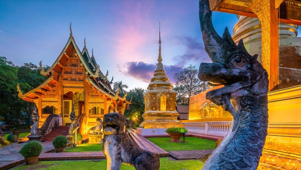 A temple with ornate architecture and a golden stupa. 5