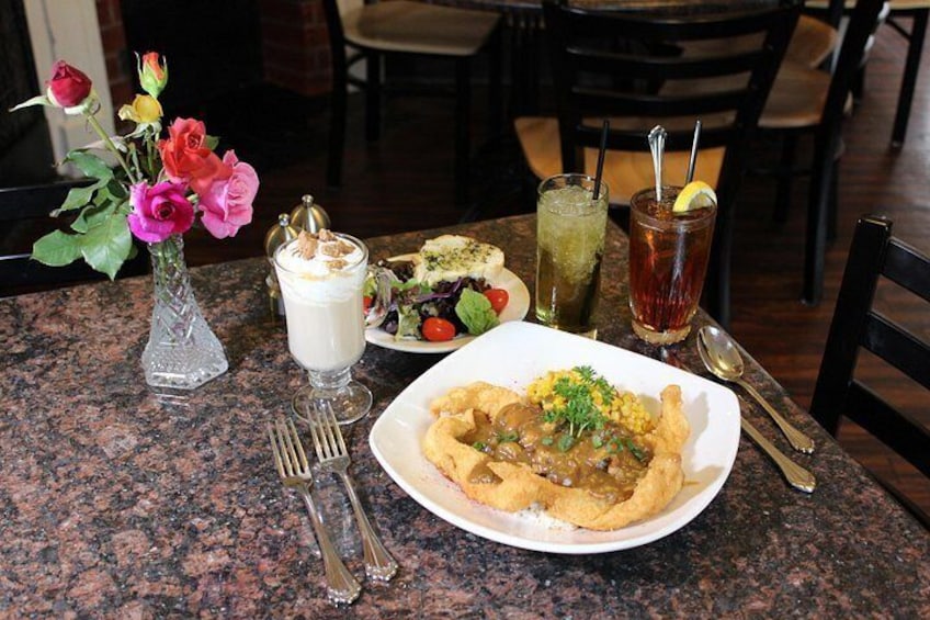 Oak Alley Cafe
Crawfish Étouffée on a bed of rice & Fried Catfish. With side salad a Glass of Iced Tea with a lemon wedge and a glass of Mint Julep 2
