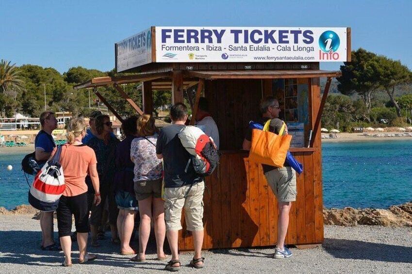 A wooden kiosk with a sign for ferry tickets. 5