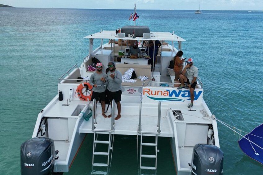 A boat with the name 'Runaway' on its side, people on board, and a lifebuoy. 2