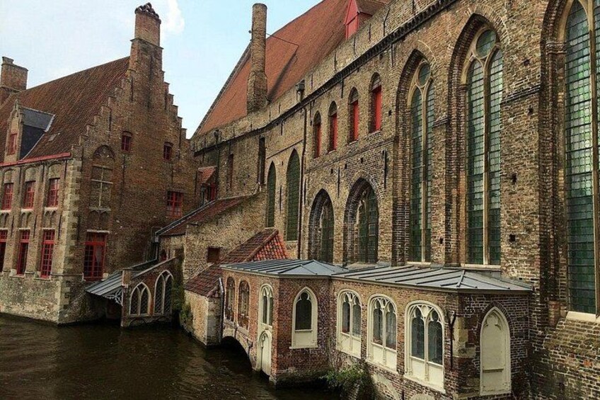 A historic building with arched windows and a brick facade. 3