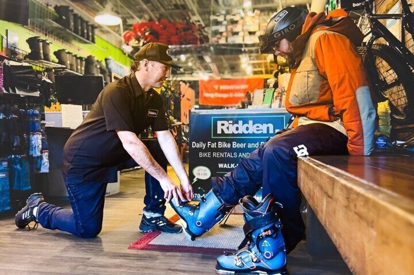 Two people fitting cycling shoes. 1