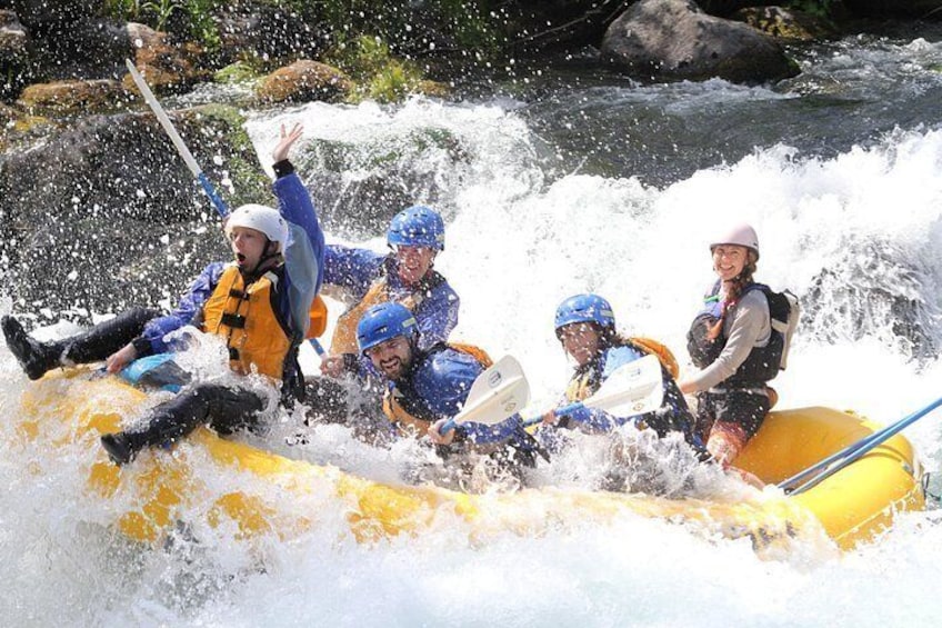 A group of people rafting on a river. 3
