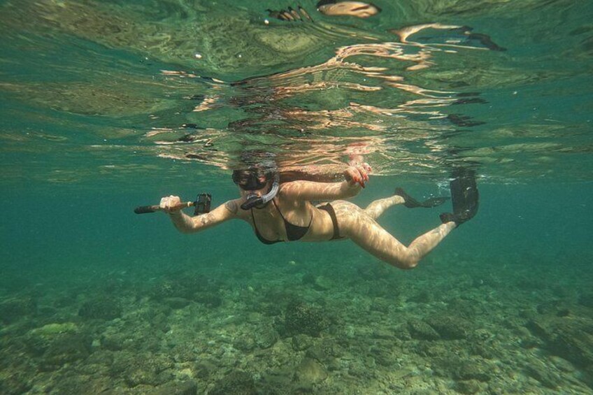 A person scuba diving underwater. 4