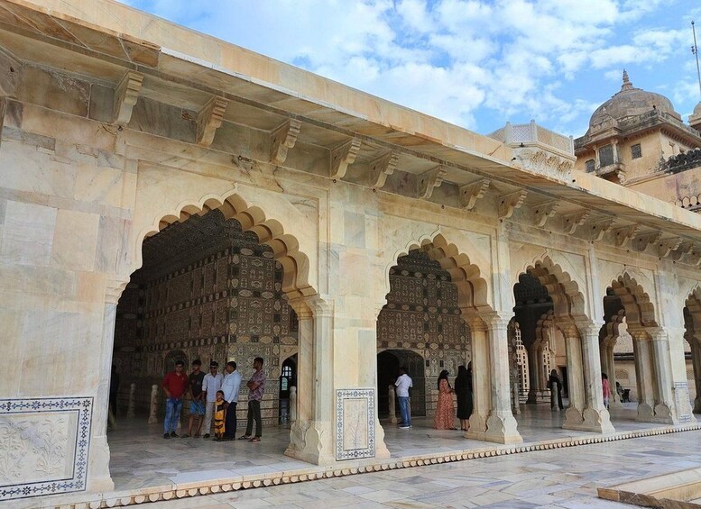 A historic building with ornate arches and detailed carvings. 2