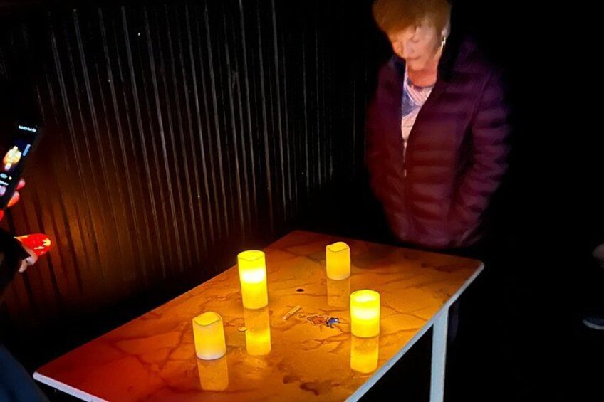 A table with lit candles. 3