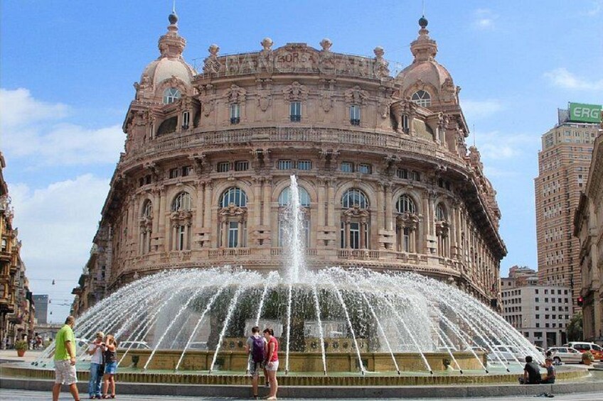 A large ornate building with a fountain in front. 5