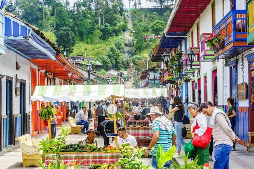 A bustling street market with vendors and shoppers. 4