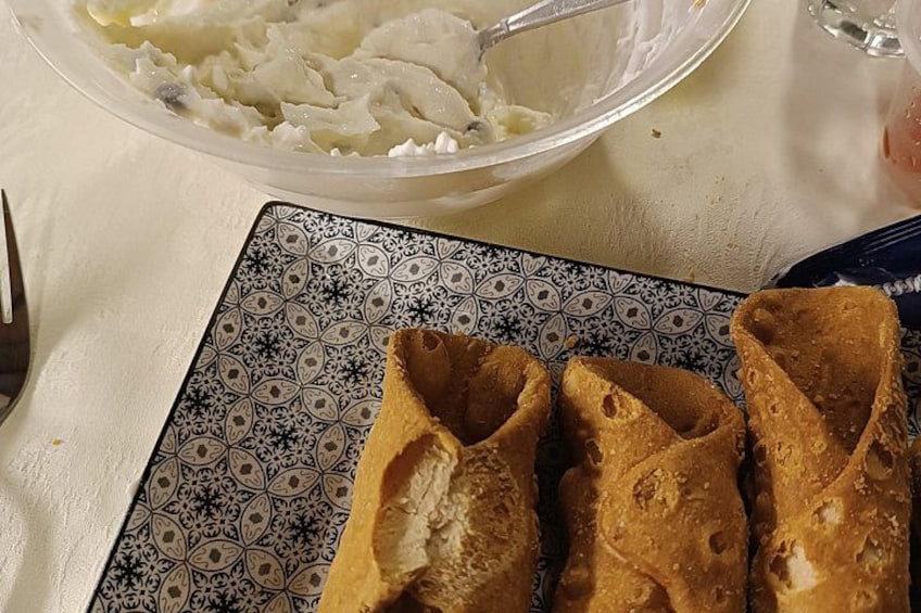 A plate of pastries and a bowl of mashed potatoes. 5
