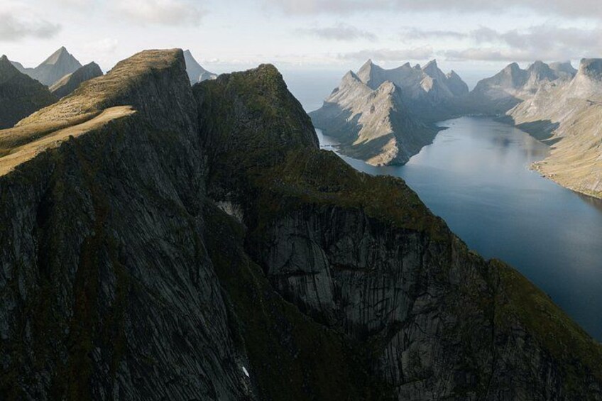 A mountainous landscape with a lake and rugged peaks. 5