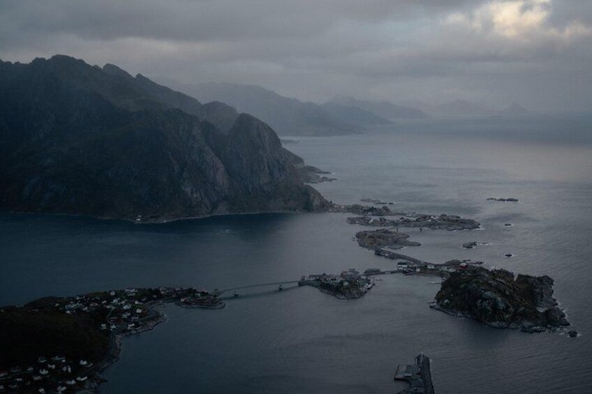 A coastal landscape with rocky outcrops and a bridge. 4
