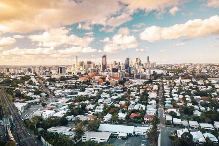 A cityscape with a dense residential area and a prominent skyline with high-rise buildings. 3
