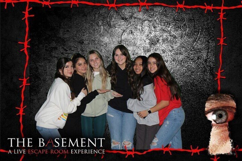 Group souvenir photo at THE BASEMENT: A Live Escape Room Experience in Las Vegas, NV