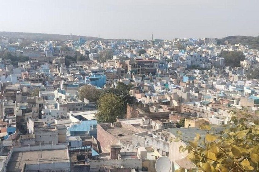 A densely populated urban area with numerous buildings and rooftops. 4
