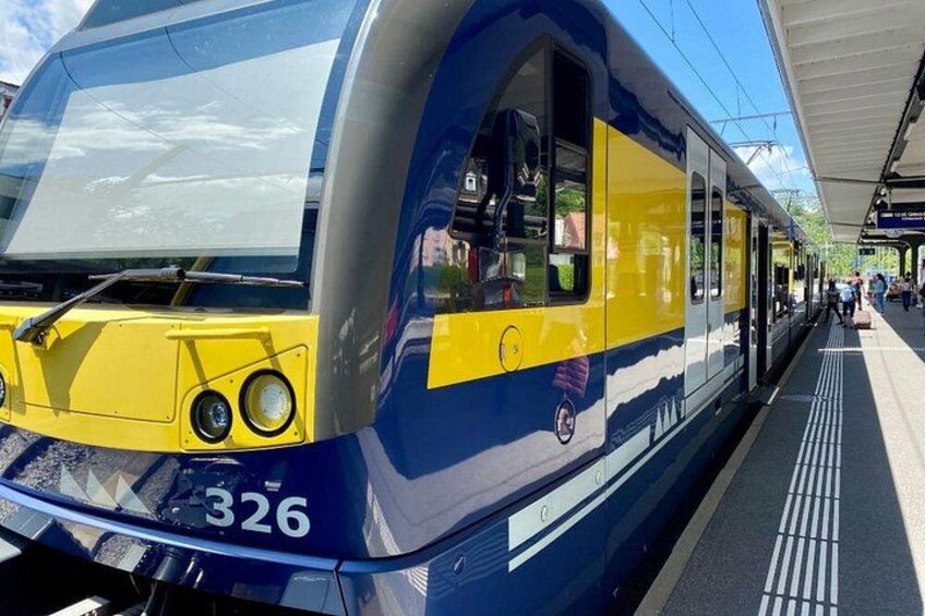 A train with the number 326 at a station platform. 2