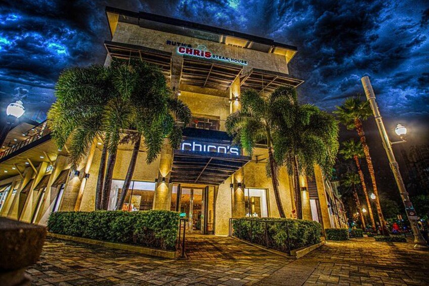 A restaurant named Chris's Steak House at night. 1