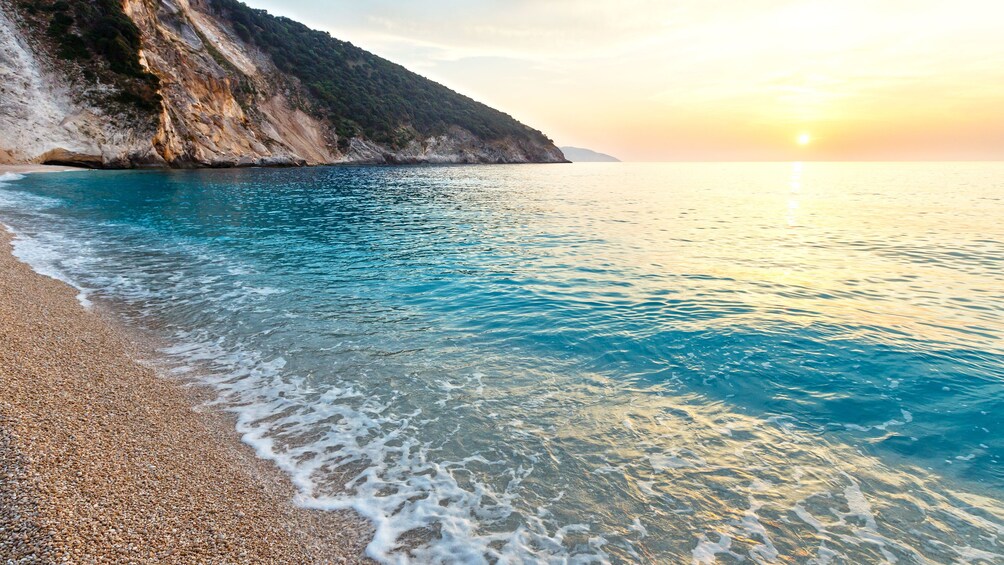 Clear blue waters washing onto Myrtos Beach on Ionian Islands