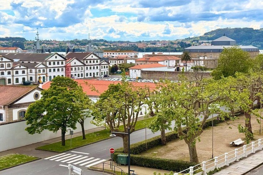 A town with historic buildings, a crosswalk, and a tree-lined street. 4
