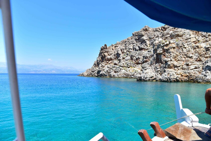 A rocky coastline with clear turquoise waters. 5