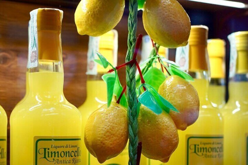 Bottles of Timoncello with lemons on a branch. 5