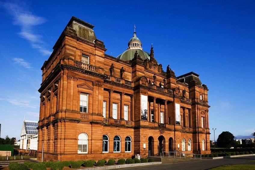 A large, historic building with a prominent dome and arched windows. 3