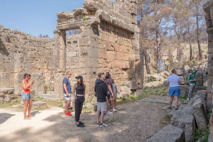 Ancient ruins with tourists exploring. 2
