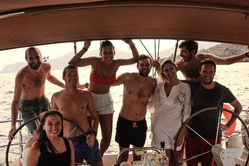 A group of people on a boat with a mountainous landscape in the background. 2