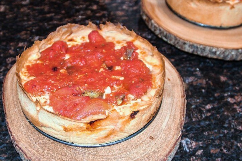A pizza on a wooden board. 4
