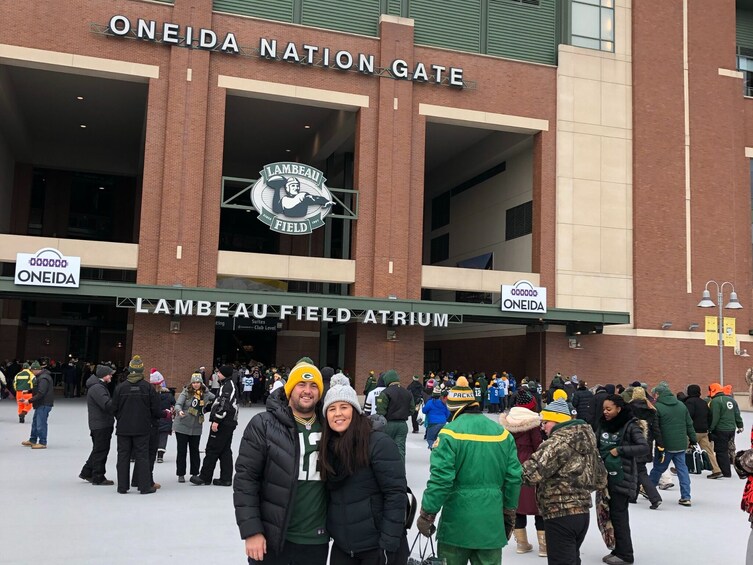Lambeau Field Atrium with Oneida signage and a crowd of fans. 3