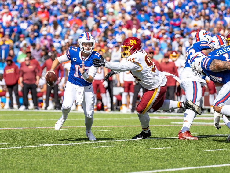 A football game with players in blue and red uniforms. 5