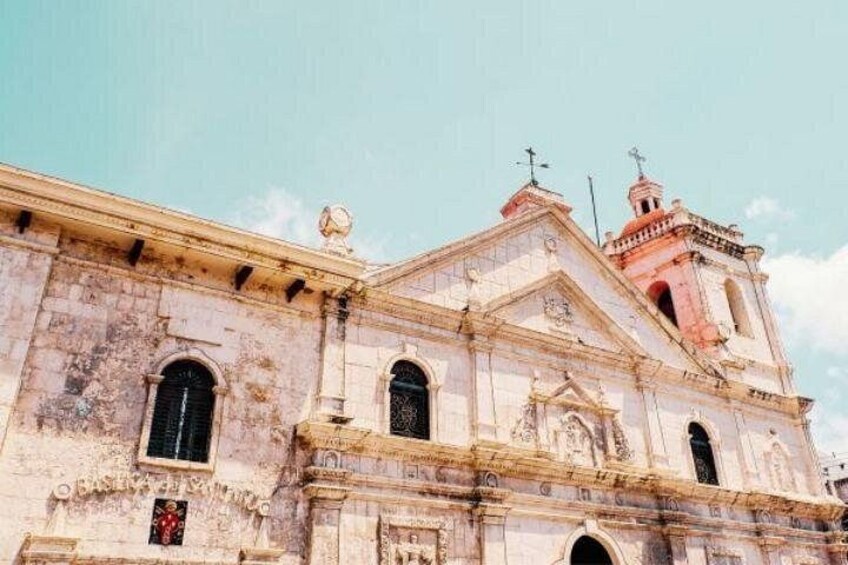 A historic building with a bell tower and arched windows. 1