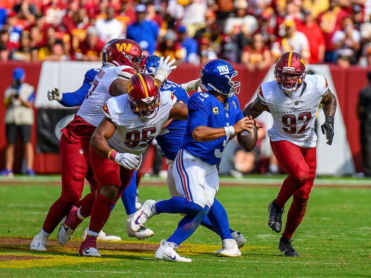 A football game with players in action on the field. 2