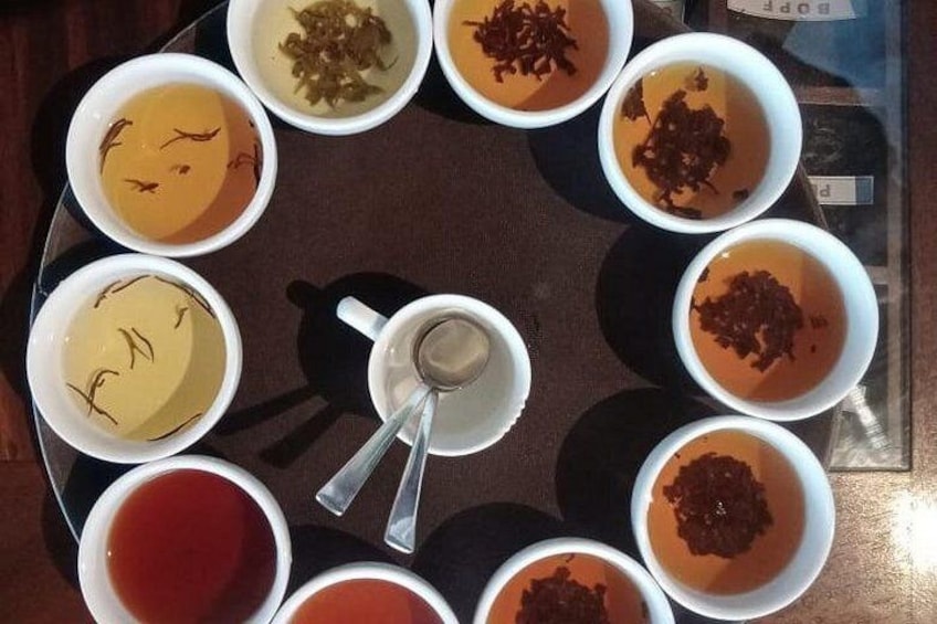 A table with various bowls of soup and sauces. 2