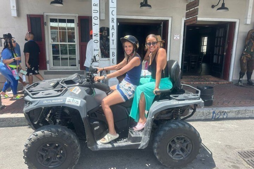 Two people on an ATV, a storefront with 'YOUR CRAFT BEING' sign, and a building entrance. 5