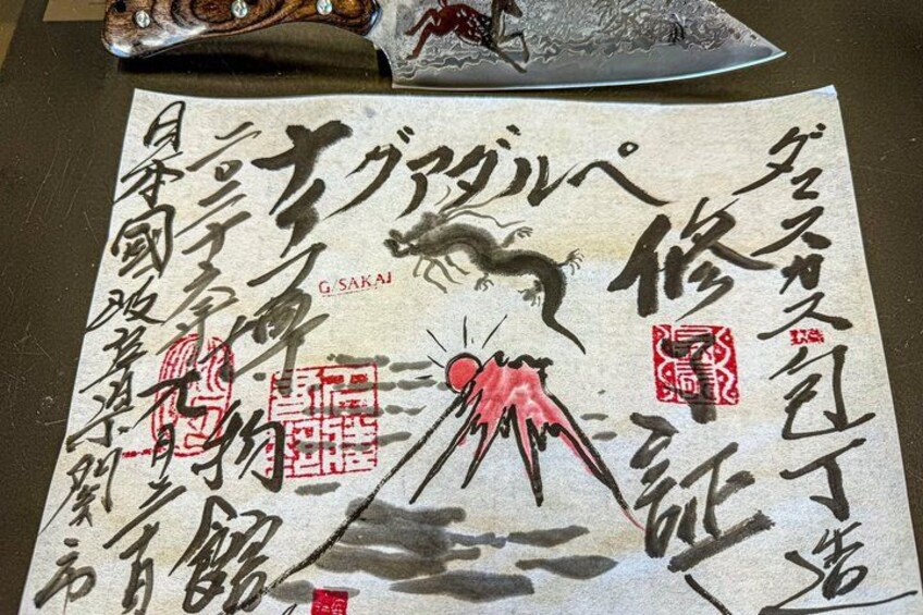 A Japanese calligraphy piece with a fox and a red seal stamp. 2