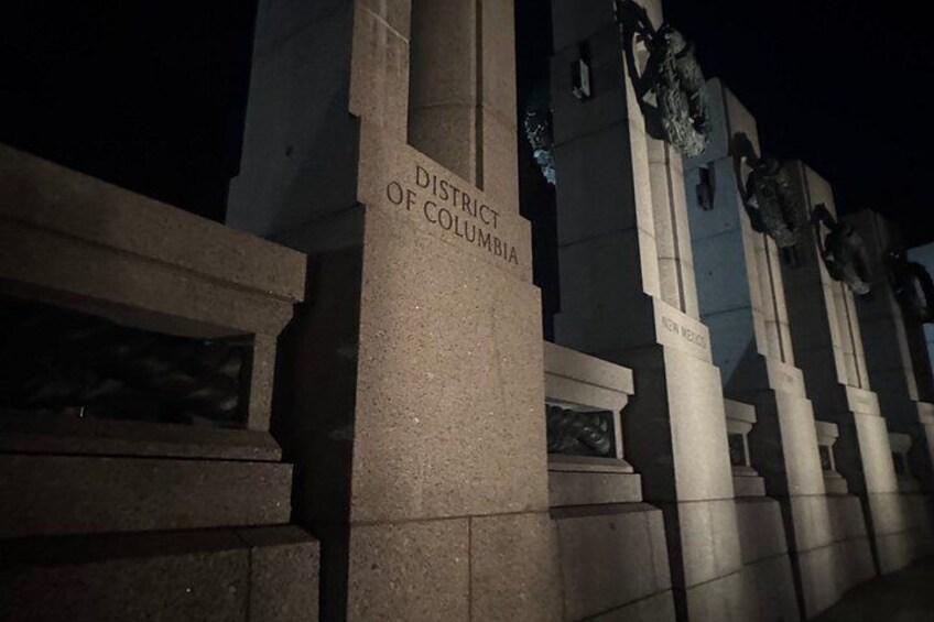 A night view of the District of Columbia's capitol building with its columns and steps. 4