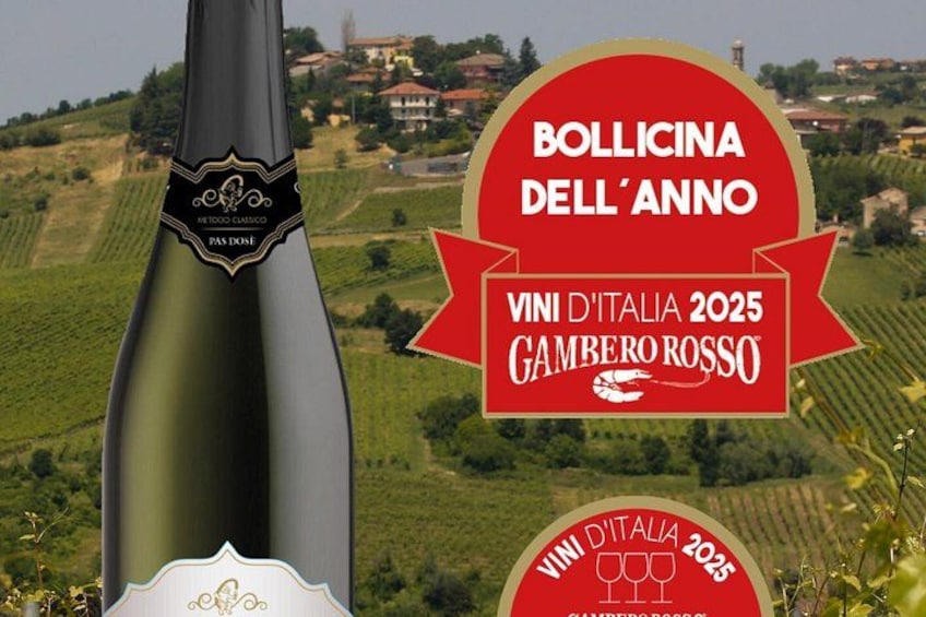 A wine bottle with a label and a red award badge. 2
