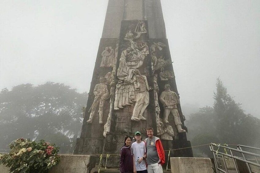 A large monument with detailed carvings of soldiers and a person on horseback. 2