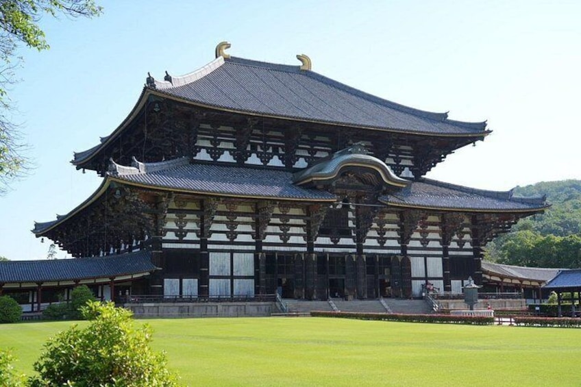 A traditional Japanese building with a curved roof and wooden structure. 5