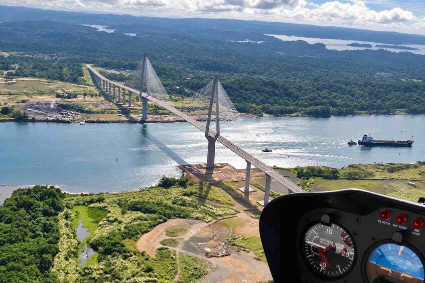 A cable-stayed bridge over a river with a ship in the water. 3