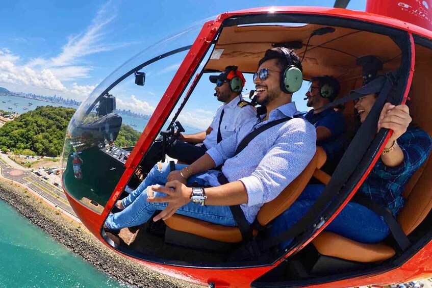 A helicopter with passengers wearing safety gear. 1