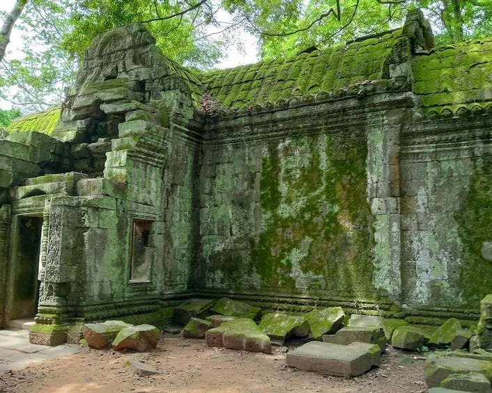 A weathered temple with moss-covered stone and a partially collapsed structure. 5
