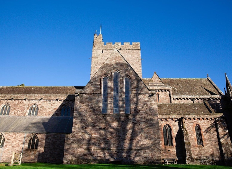 A historic church with a prominent tower and arched windows. 4