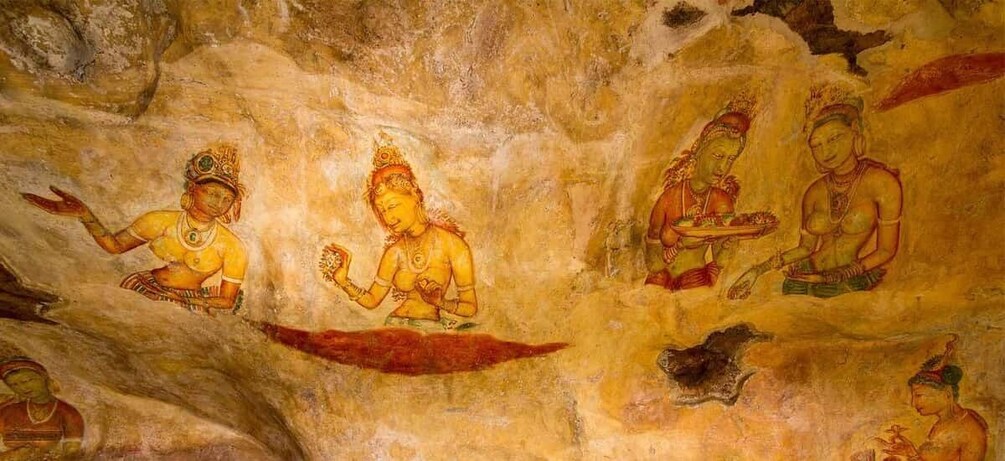 A cave with ancient frescoes of deities and figures. 3
