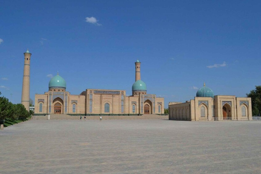 A large mosque with two domes and two minarets. 2