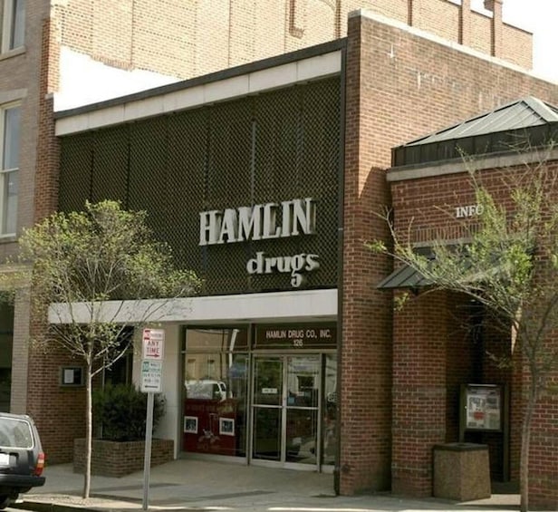 A brick building with a sign that reads "HAMLIN drugs". 1